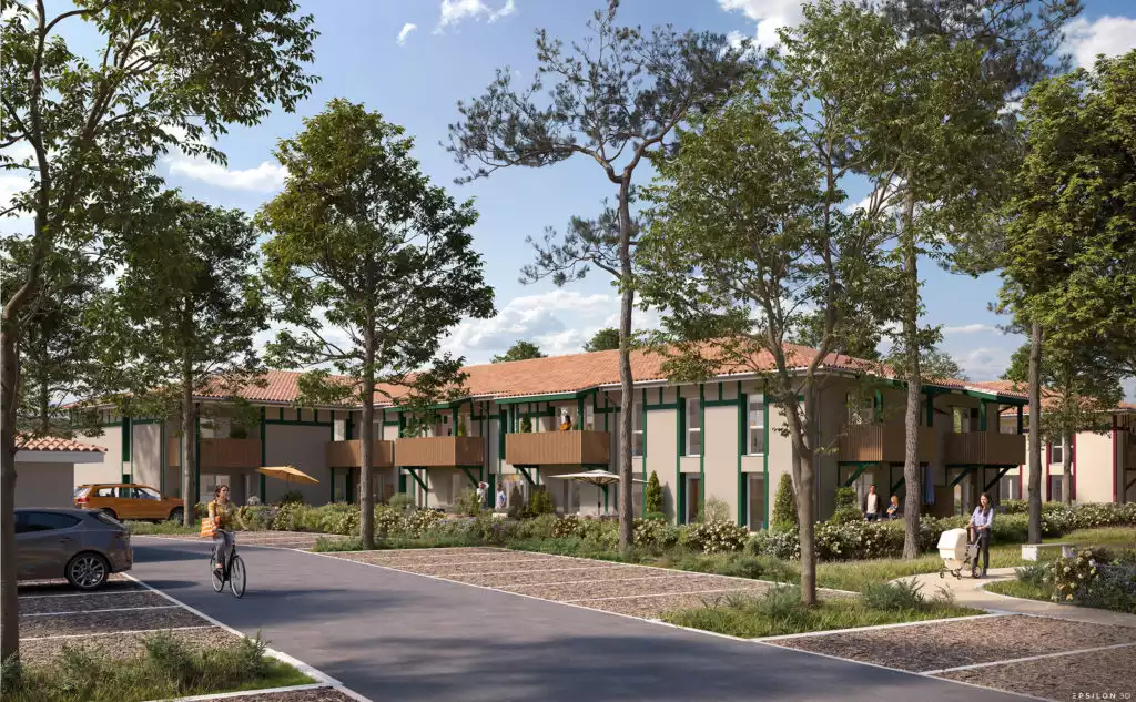 Réalisation complète d'un programme immobilier dans son environnement naturel, on y voit des bâtiments avec des façades claires, rythmées par des éléments de structure en bois de couleur verte et des balcons privatifs. La toiture en tuiles canal souligne l'ancrage régional du projet.