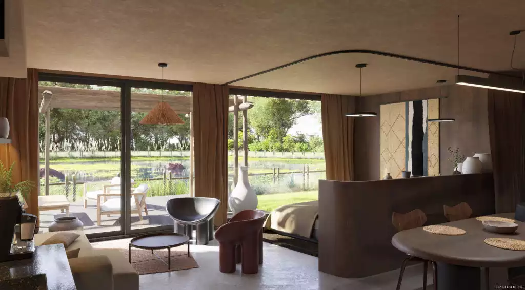 Ce projet de visualisation 3D illustre la conception d'un lodge de luxe immersif, niché au cœur d'un environnement sauvage et verdoyant, offrant une proximité inédite avec la faune africaine. L'architecture extérieure se distingue par une façade en bois brûlé rythmée par une structure verticale organique, tandis que les intérieurs déclinent une esthétique "raw chic" mêlant murs à la chaux, mobilier contemporain et touches artisanales. À travers une vue plongeante en plan-masse et des rendus photoréalistes, on découvre un aménagement fluide où le salon et la chambre s'ouvrent largement sur une terrasse privée avec pergola, offrant une vue imprenable sur un plan d'eau peuplé d'hippopotames. Ce travail de rendu souligne une maîtrise précise de la lumière naturelle et des textures, créant une atmosphère sereine et haut de gamme qui redéfinit l'expérience du safari moderne.